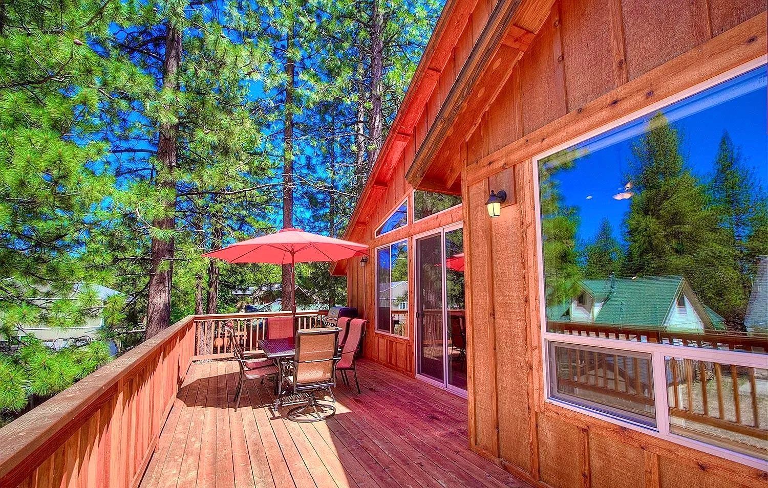 A vase of flowers is sitting on a table next to a window.