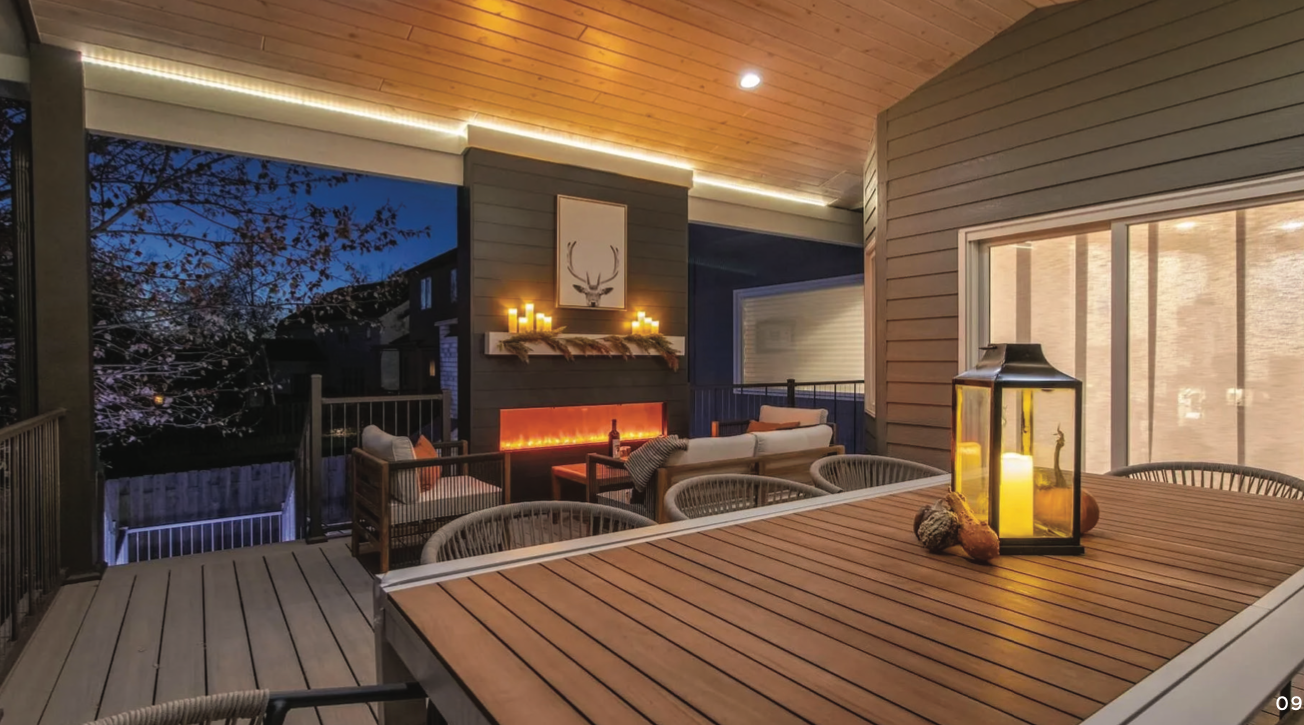 A wooden pergola is sitting in front of a brick house.