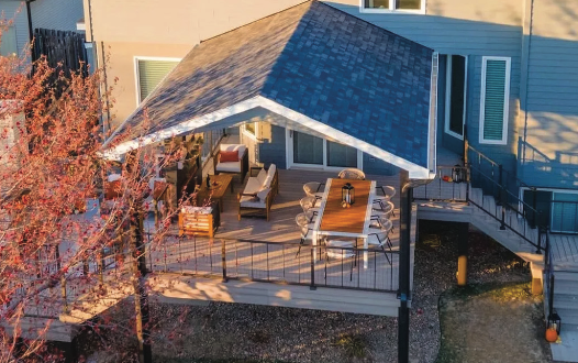 The back of a house with a deck and stairs.