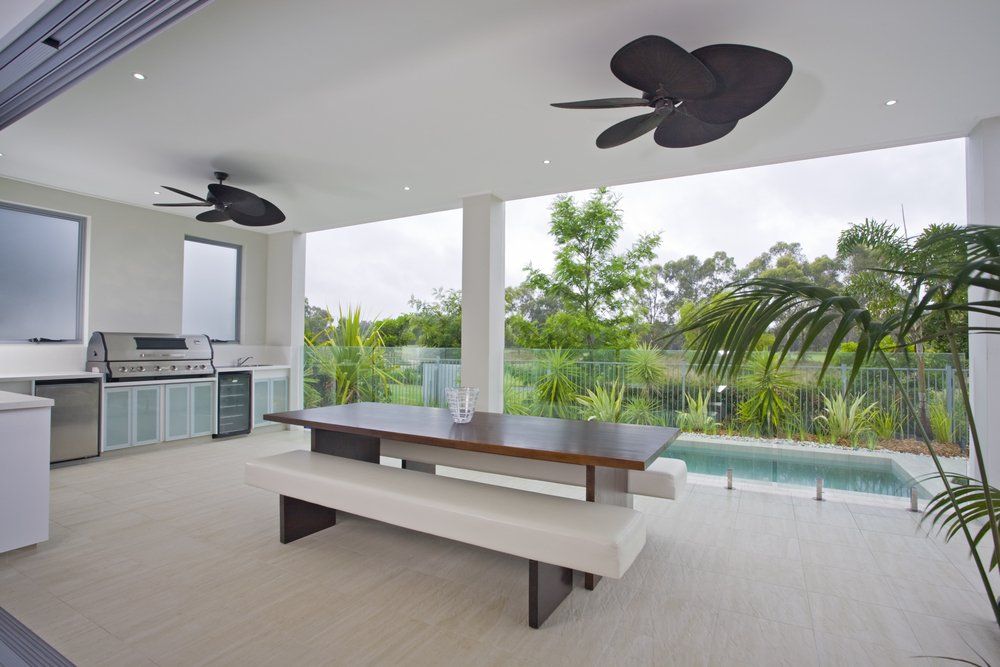 Outdoor Entertainment Area with Pool and BBQ — Builders in Salt Ash, NSW
