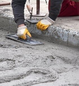 Worker Leveling Concrete Floor
