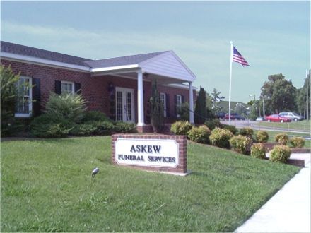 Askew Funeral Services building with American flag.