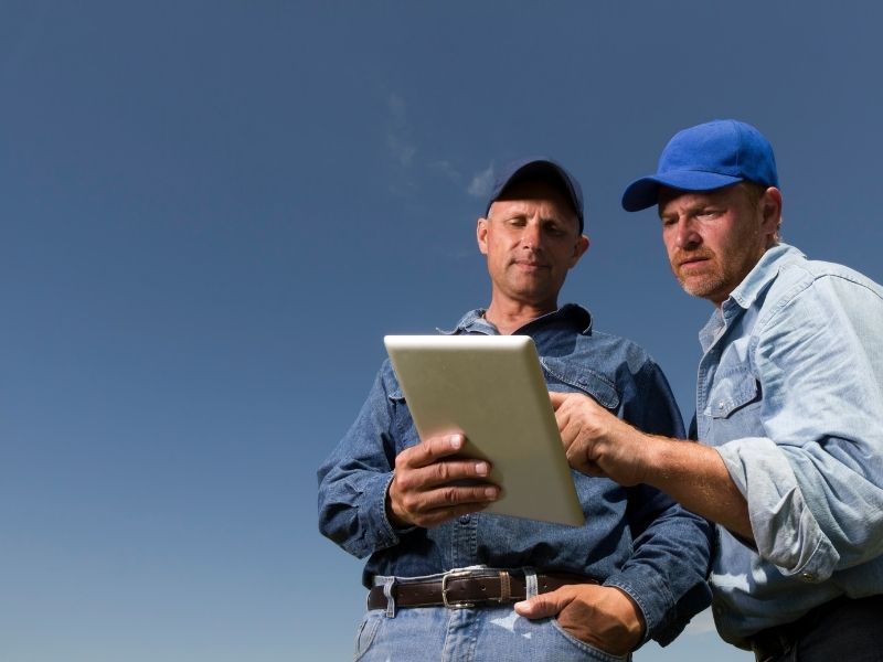 two home contractors analyzing paper work