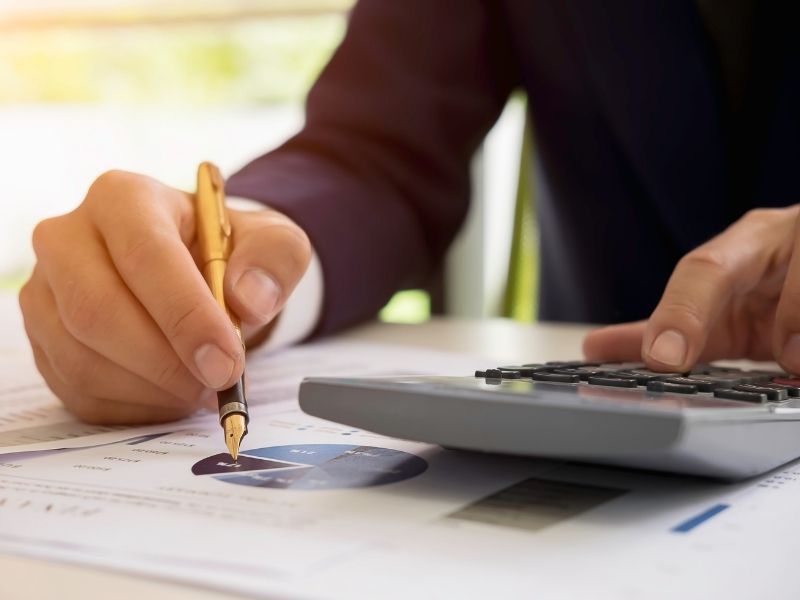 gentleman doing taxes at desk
