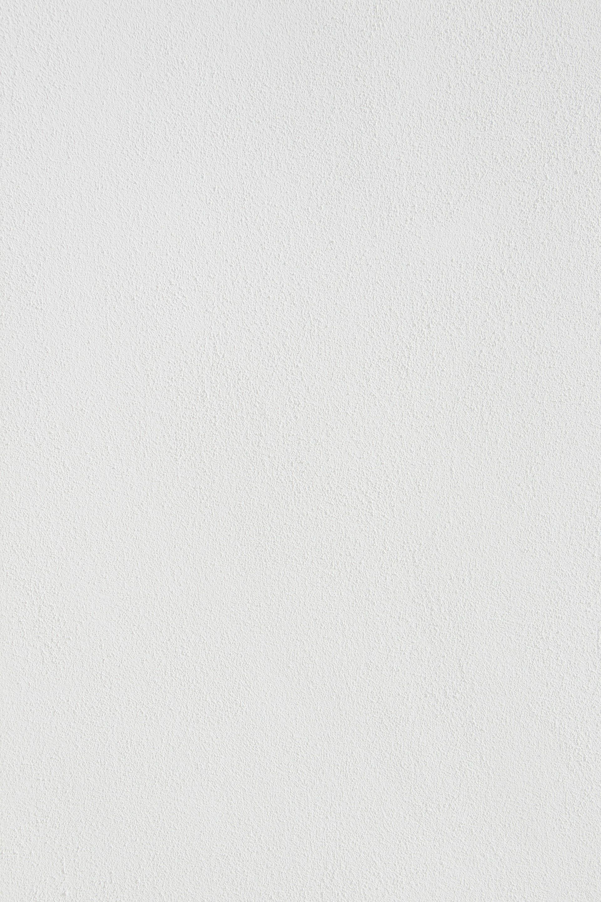 A close up of a white paper texture.