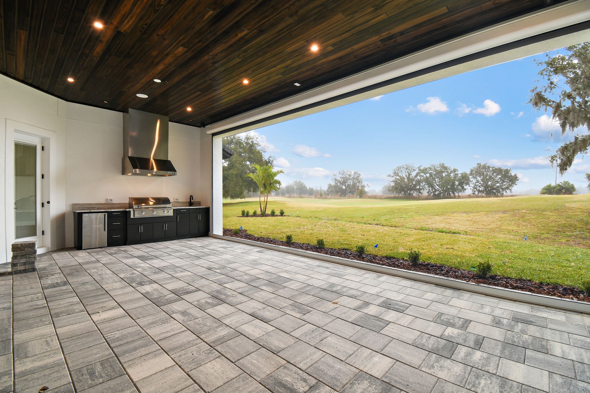 Paver lanai with outdoor kitchen.
