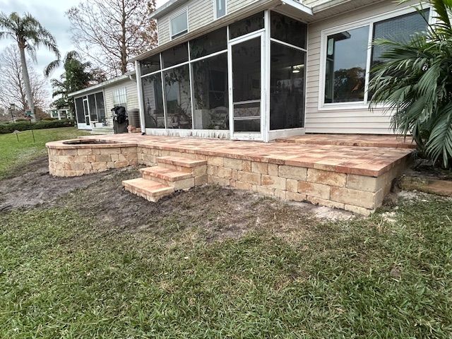Flagstone's Heritage Pavers in Cream/Orange/Brown supported by Stonegate Wall Block in Cream/Beige