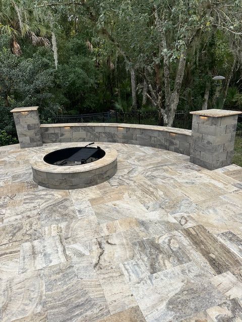 Alaskan Silver Travertine in French Pattern with Coordinating Fire Pit and Sitting Wall