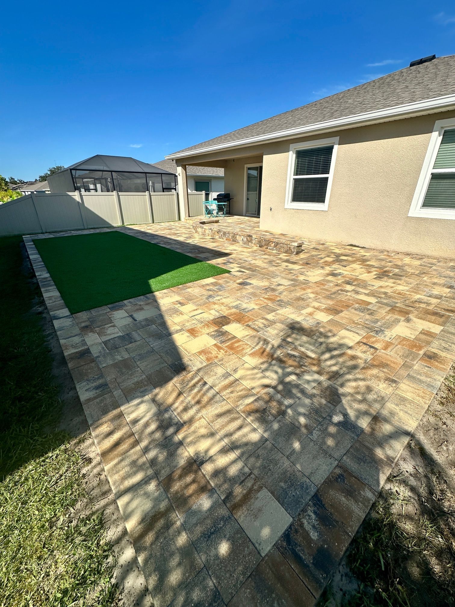 Cream Beige Charcoal Patio with Turf Inlay