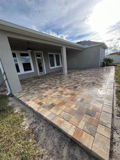 Non screened in paver patio with beige pavers