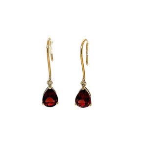 Gold drop earrings with red teardrop gemstones
