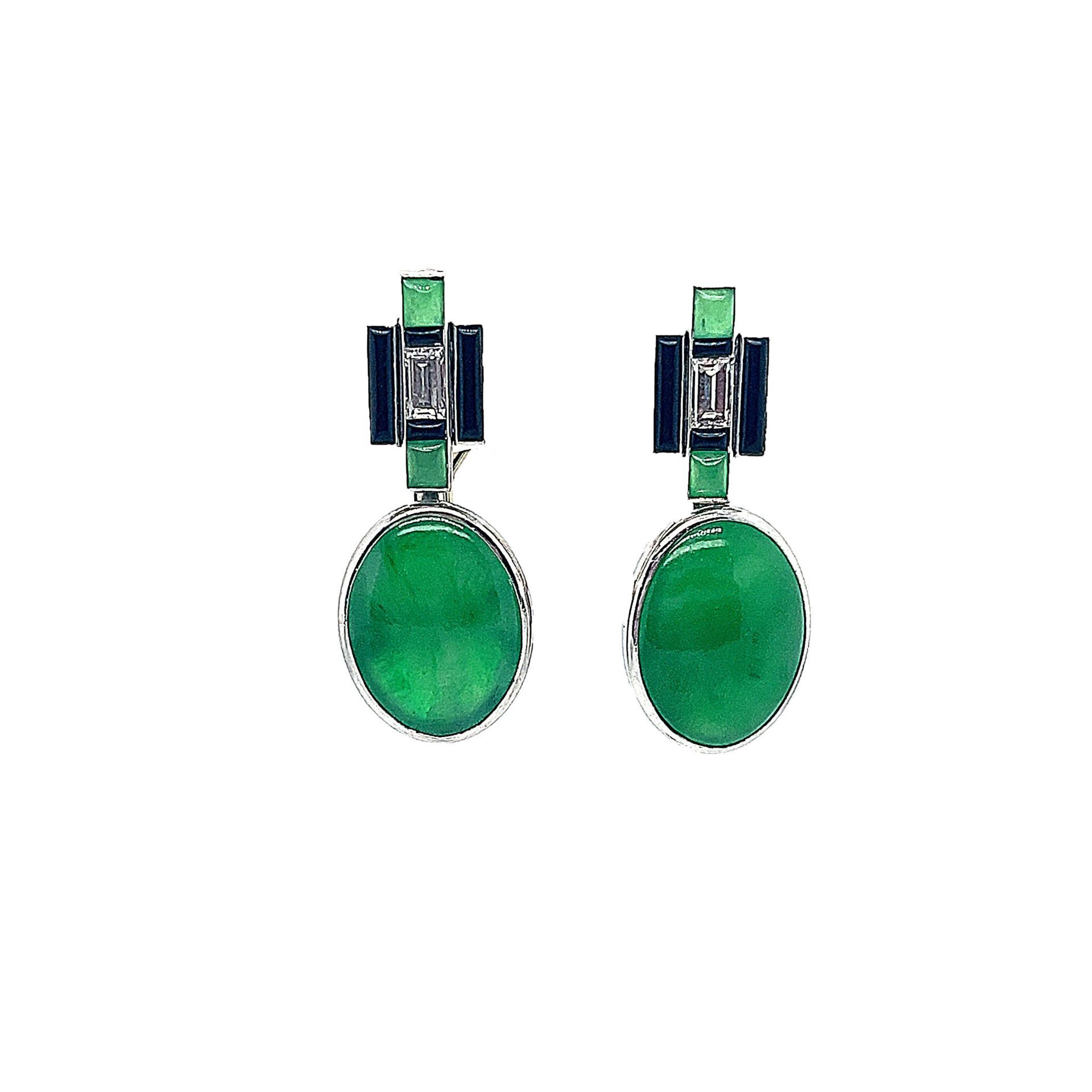 Pair of green oval gemstone drop earrings with dark rectangular accents on a white background
