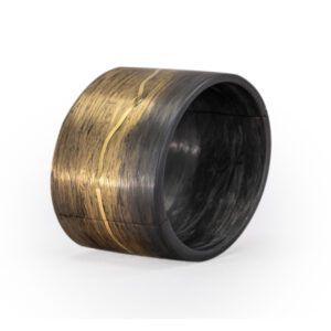 Dark metal barrel with a gold band, lying on its side on a white background