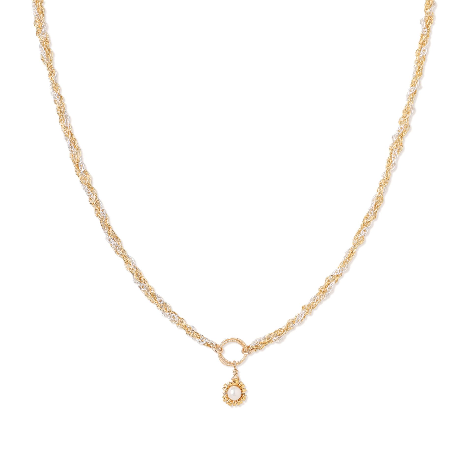Gold chain necklace with a teardrop pendant and small circular charm