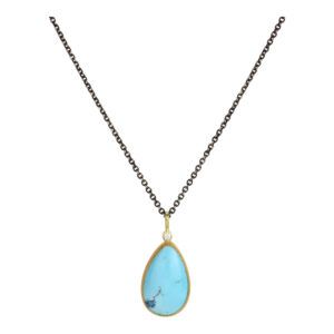 Gold chain necklace with a teardrop-shaped blue pendant