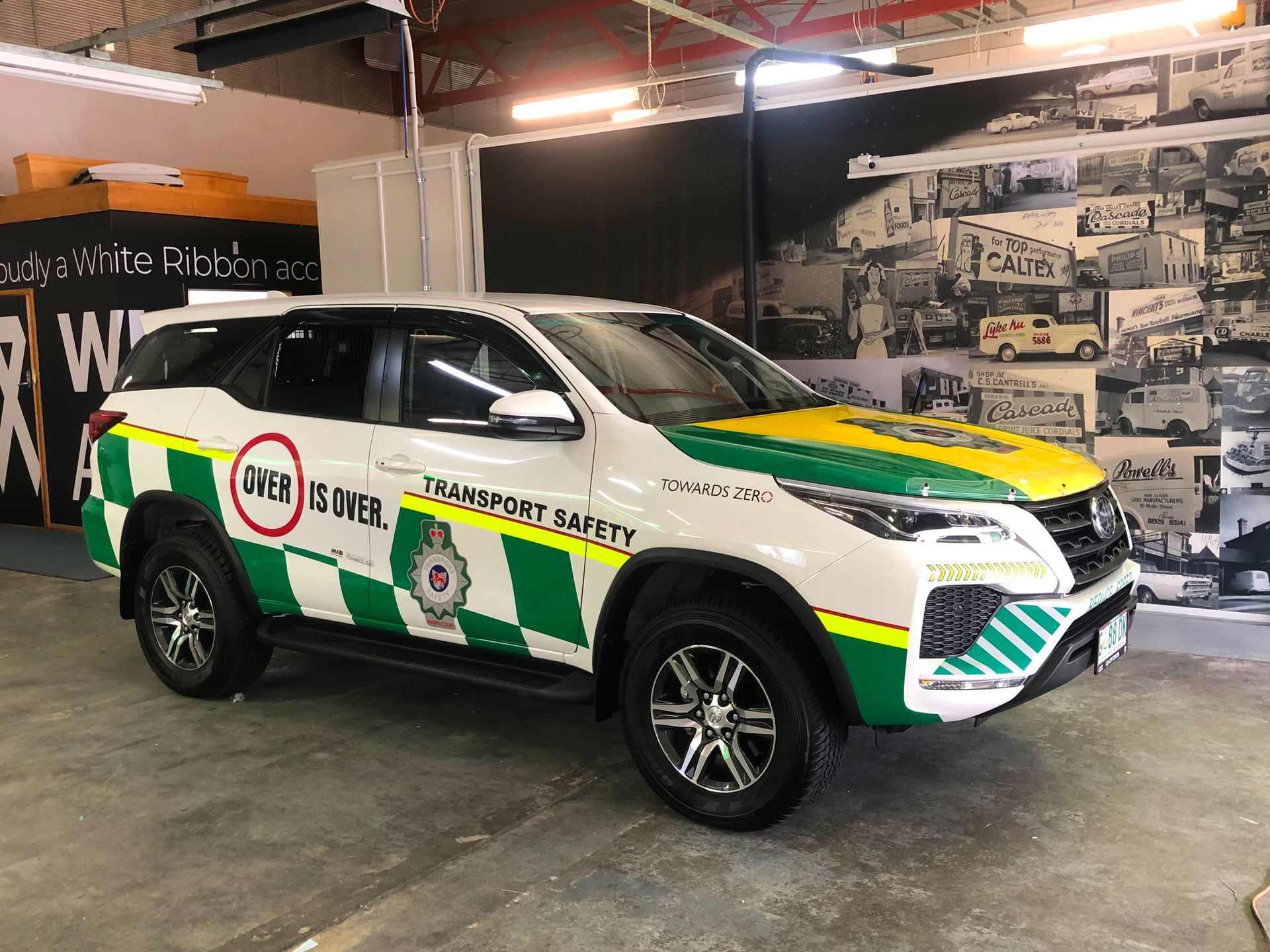 White and green transport safety vehicle.