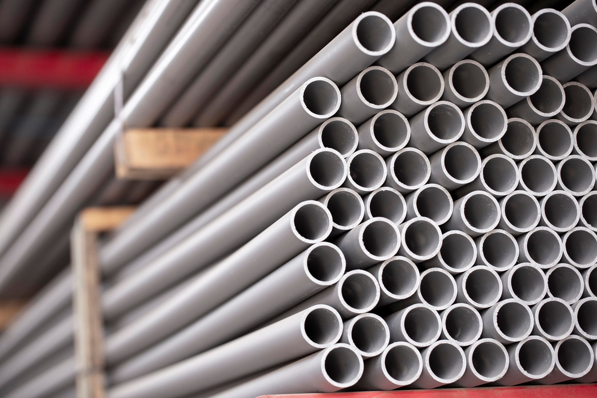 A bunch of pipes are stacked on top of each other