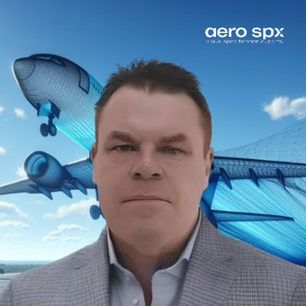 A man in a suit stands in front of an aero spx logo