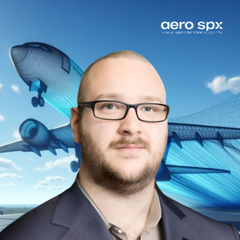 A man wearing glasses is standing in front of an aero spx logo