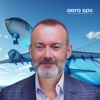 A man in a suit stands in front of an aero spx logo