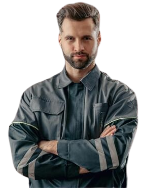 A man with a beard is standing with his arms crossed.
