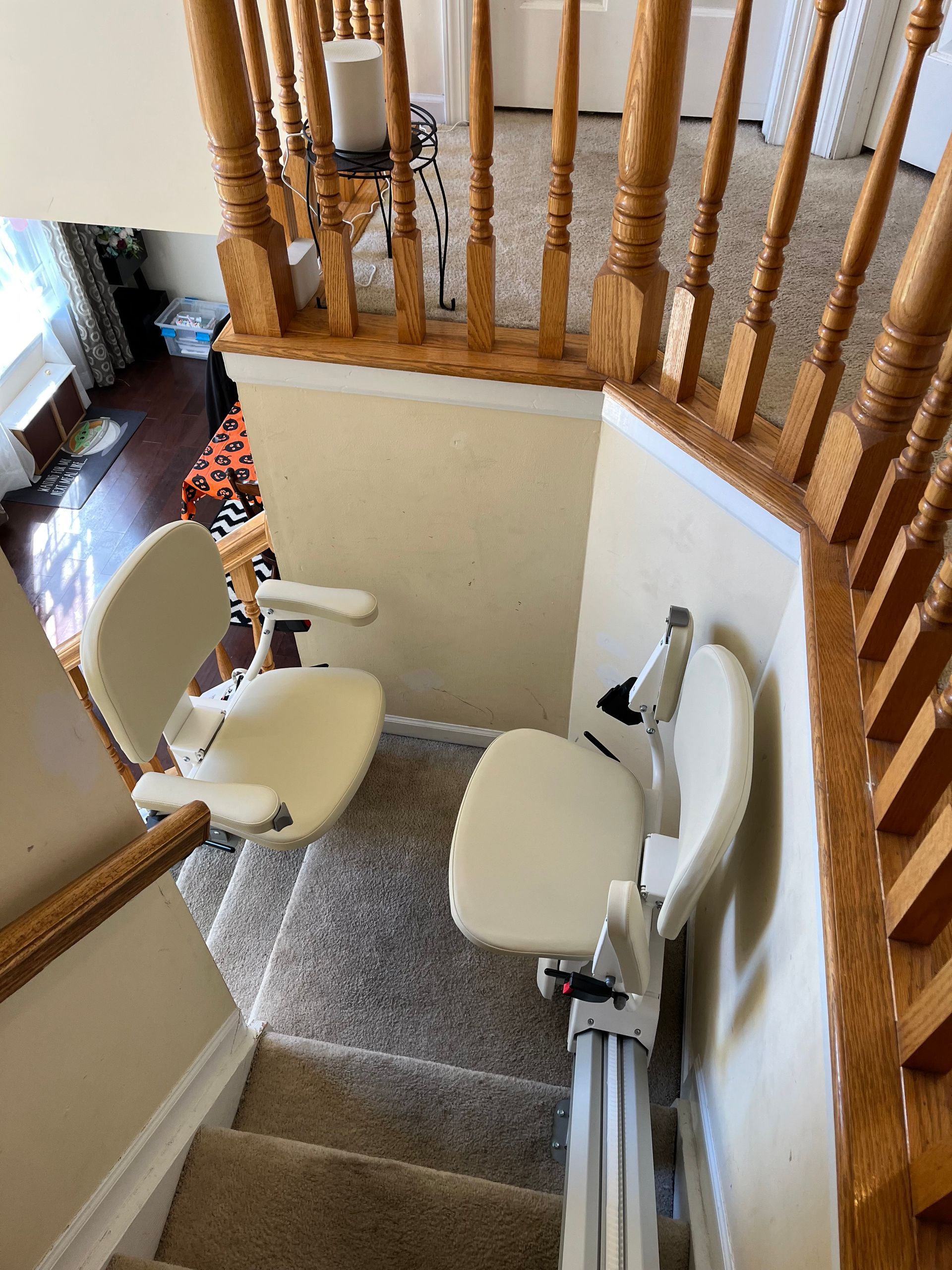 A white chair is sitting on top of a set of stairs.