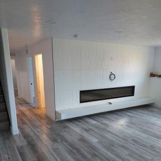 There is a fireplace in the middle of the room.