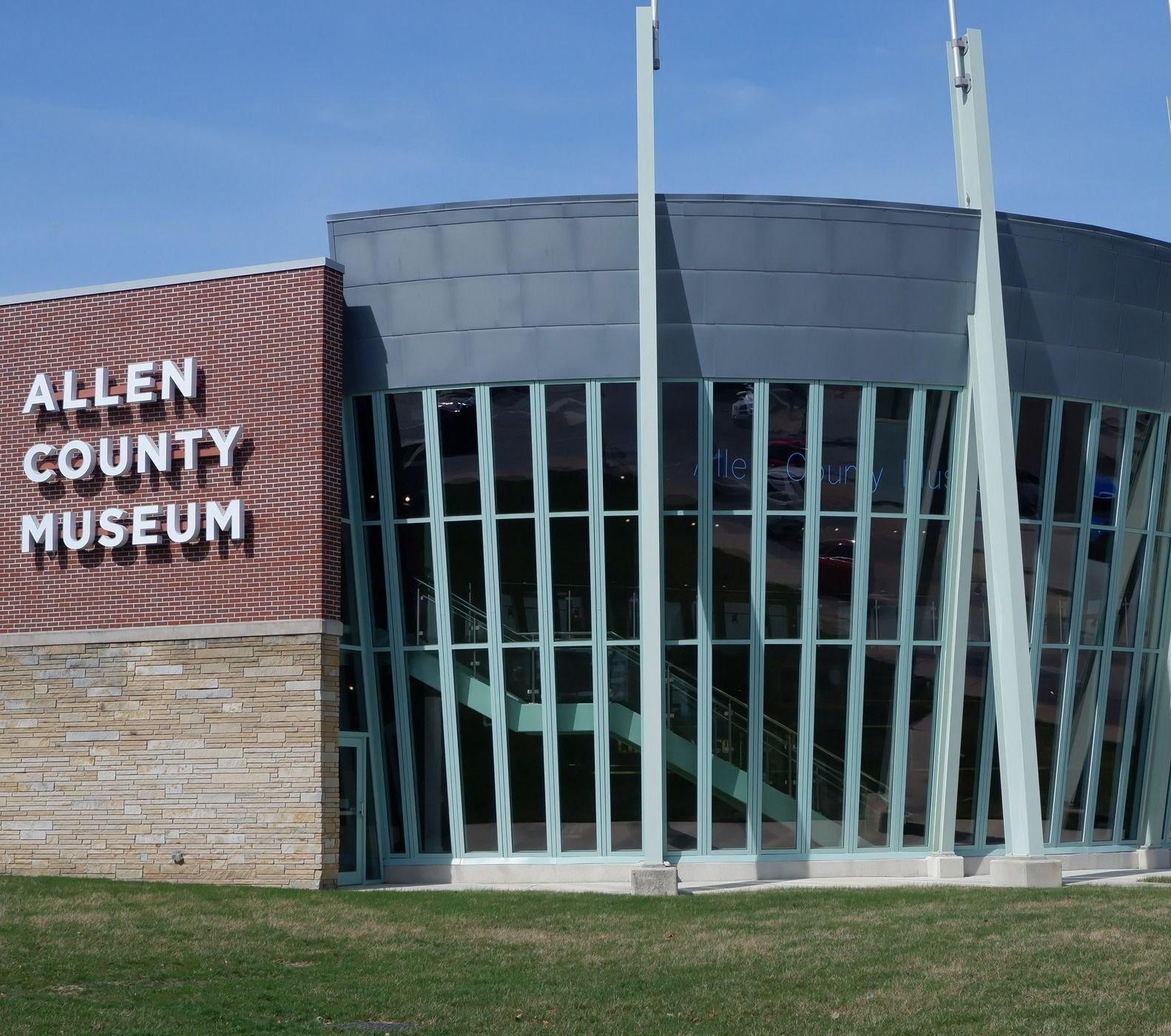 Allen County Museum front with sign and glass window showing antique train.