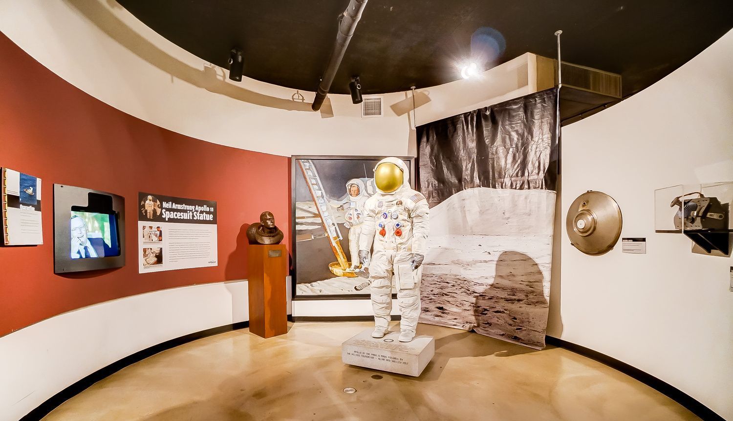 A room with a statue of an astronaut on display