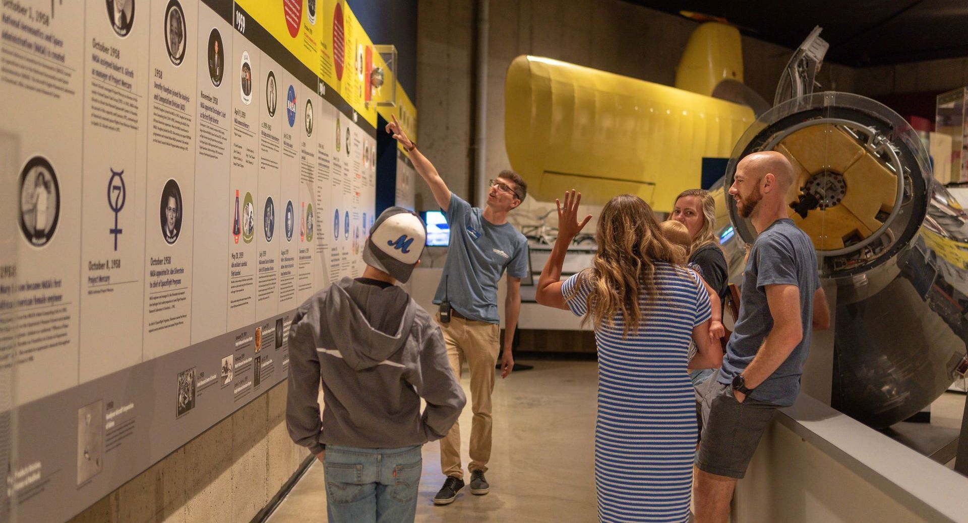 A group tour in the Early Gallery of the  Armstrong Air & Space Museum.