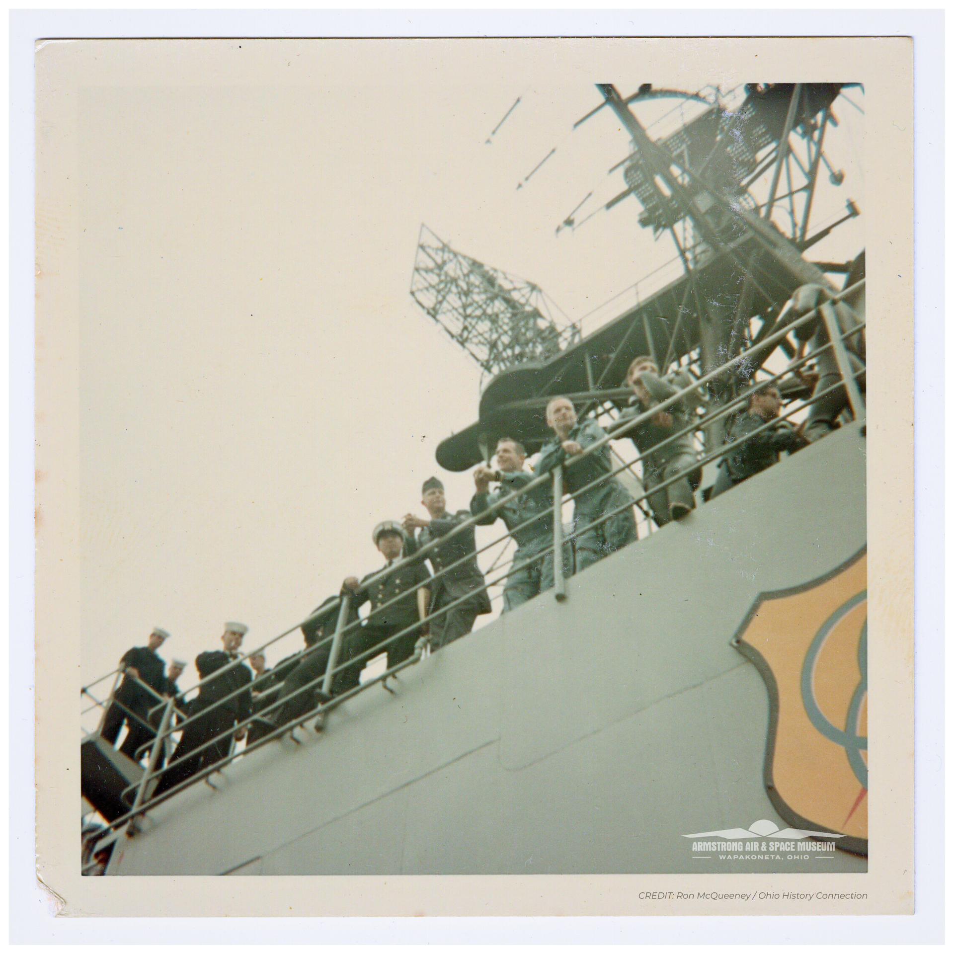 Neil Armstrong and David Scott look out on the deck of the USS Mason, March 1966.