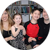 A family is posing for a picture together in a circle.