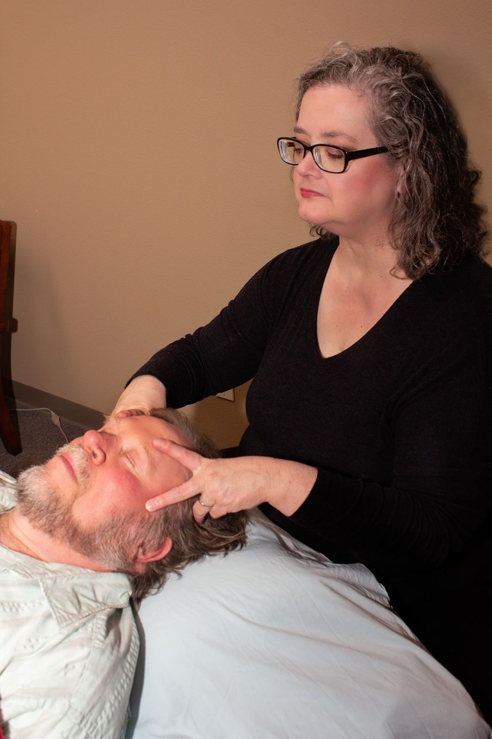Jennifer with family and doing her work