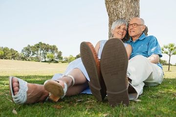 senior couple sitting by tree relaxing - Glasses in South Gate, CA
