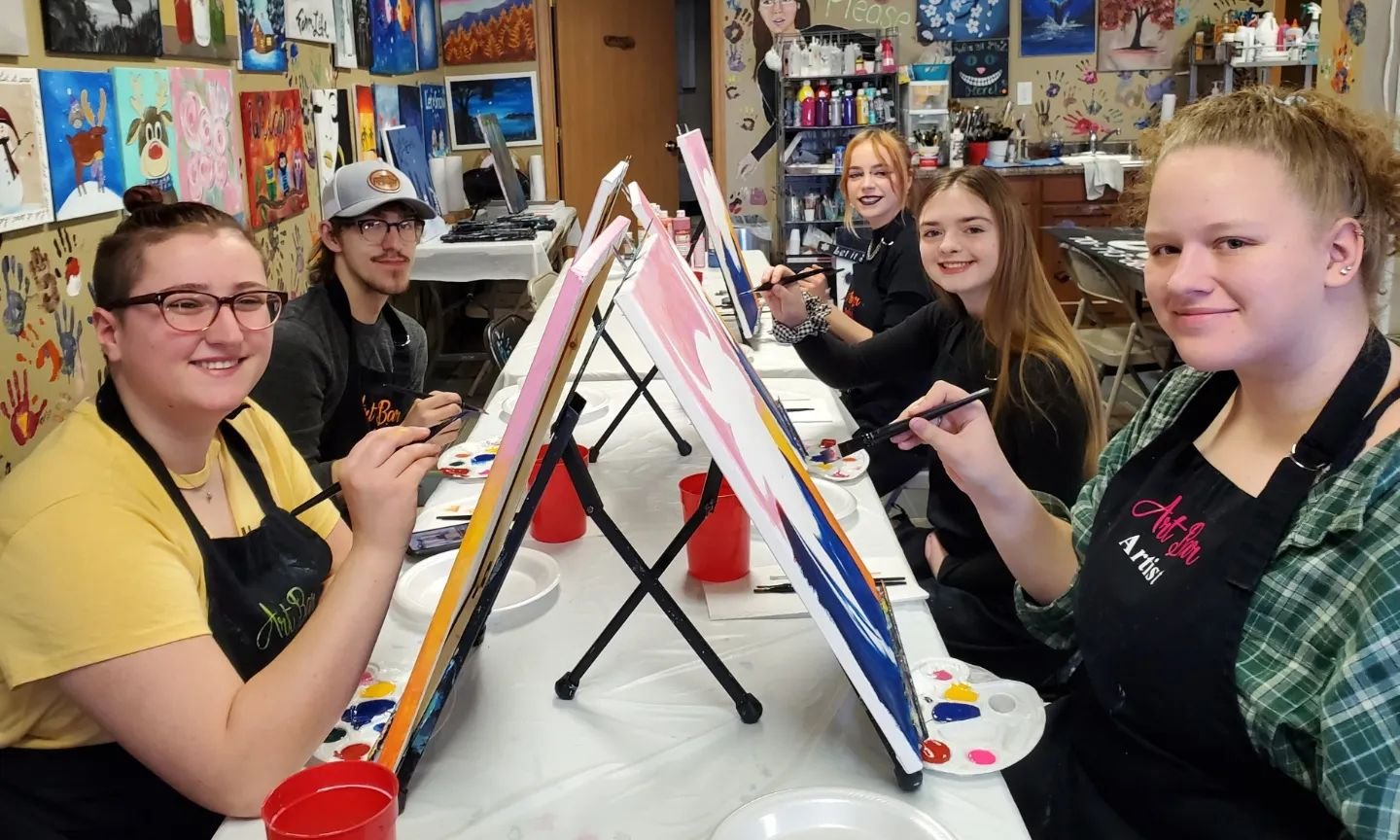 Clients showing their artworks