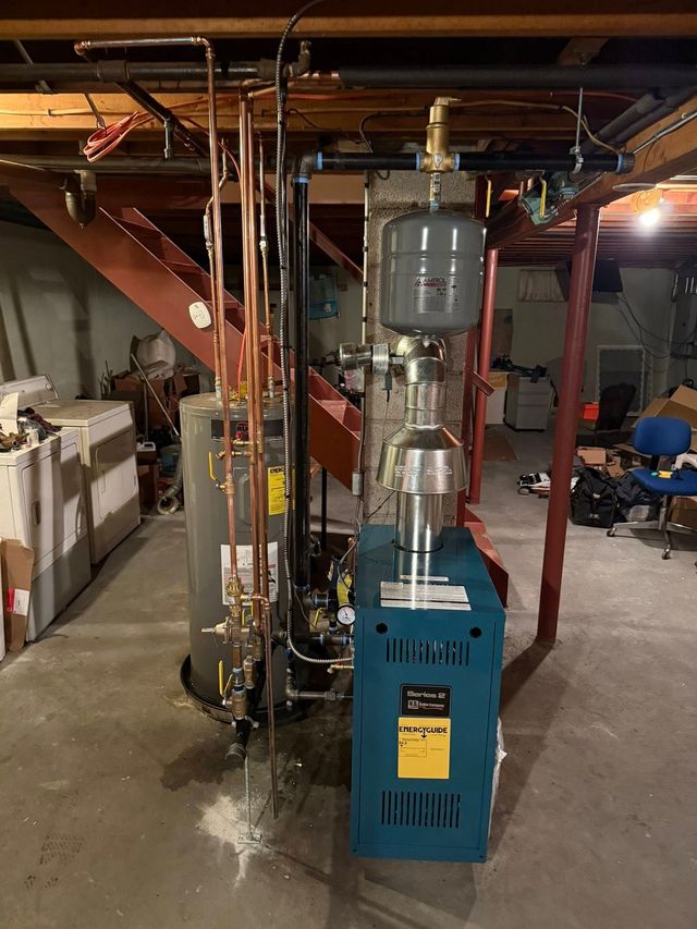 Mitsubishi HVAC unit outside a house, with a garden of colorful flowers in the background.