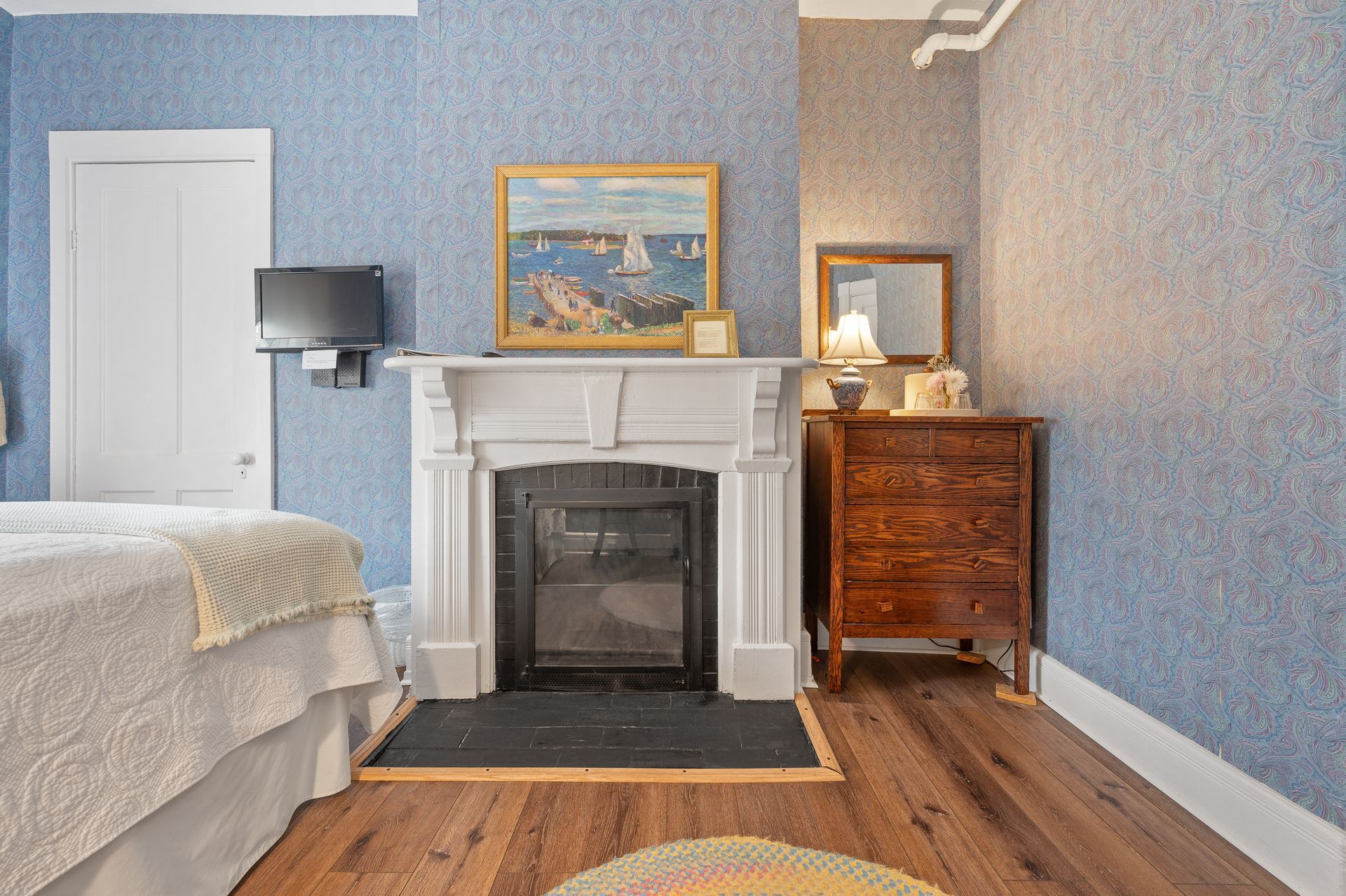There is a fireplace in the middle of the room in the bedroom.