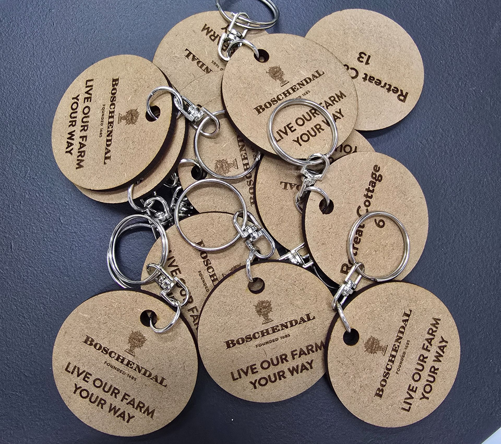 Three black water bottles with silver lids and