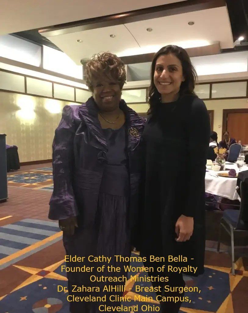 Two women are posing for a picture in a room.