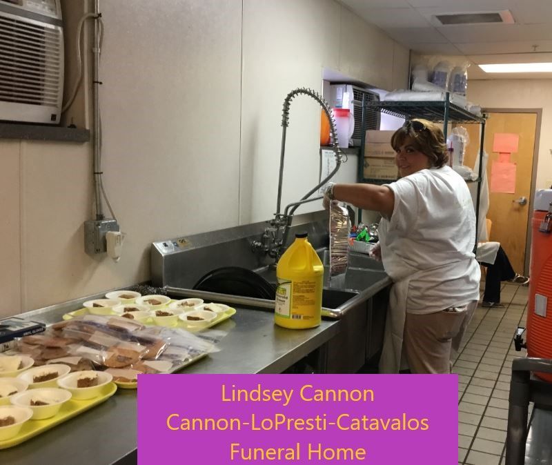 Lindsey cannon is washing dishes in a kitchen