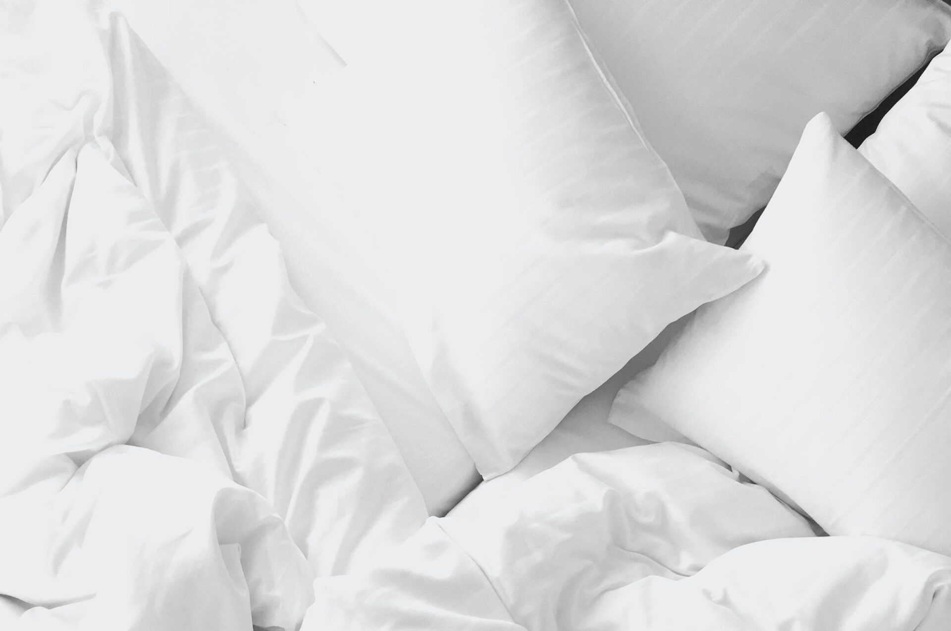 White pillows on a bed.