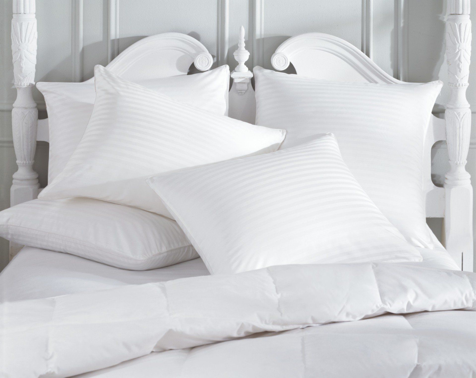Clean pillows on a nice bed.