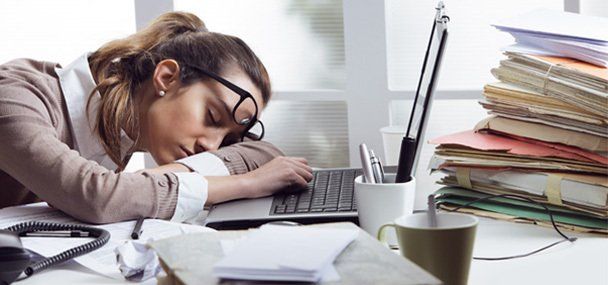 A woman at work feeling fatigue