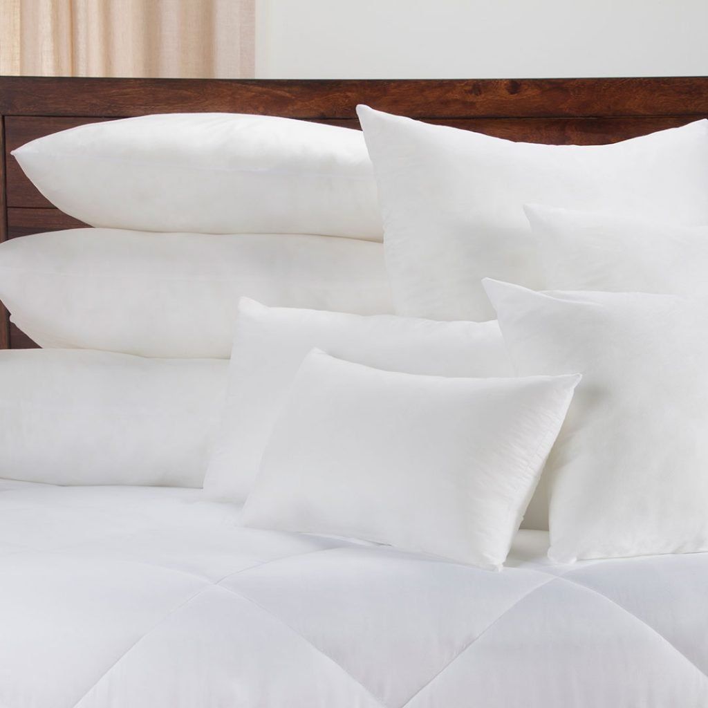 Different pillow sizes on a bed