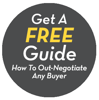 A sign that says get a free guide how to out-negotiate any buyer