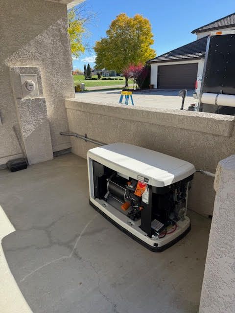 Outdoor generator on a concrete pad near a house. Partially open, wires visible. Sunny day.