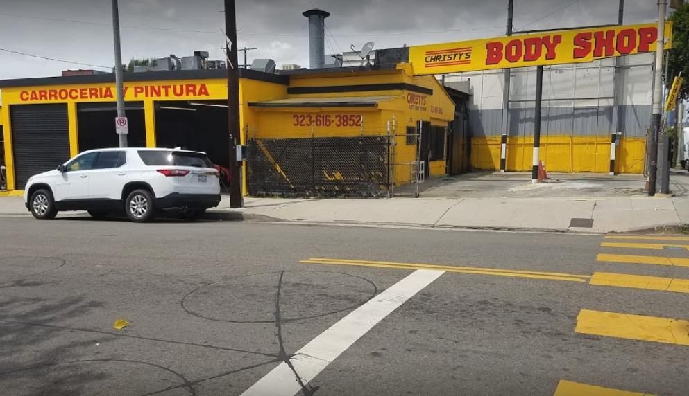 A rack for loading smartphones with a view of neatly organized cell phones, charging plugs, and wires.