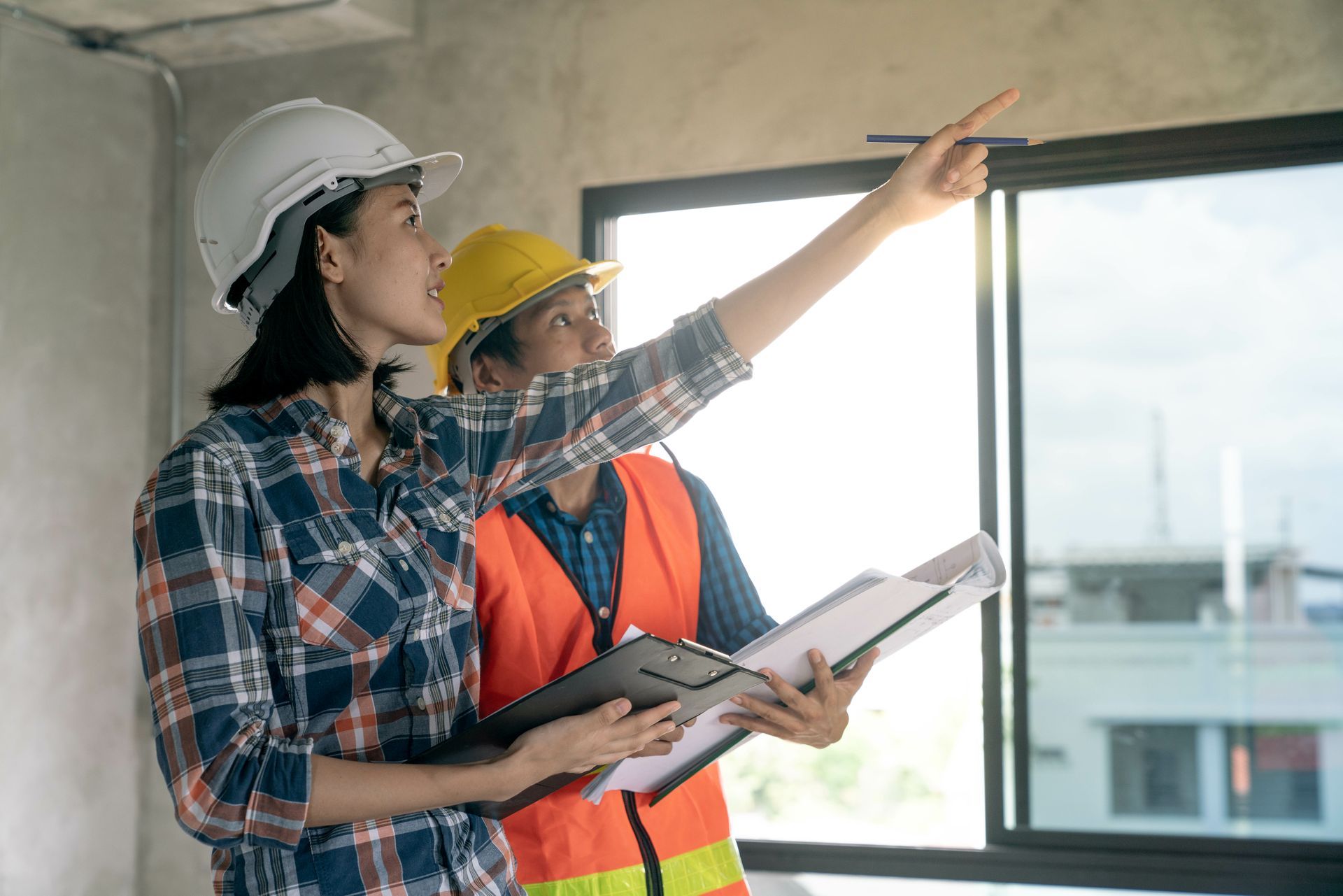 A rack for loading smartphones with a view of neatly organized cell phones, charging plugs, and wires.
