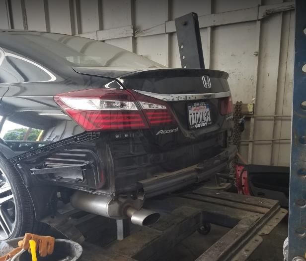 Recreational vehicle (RV) connected to an external electricity source with power cord plugged in.