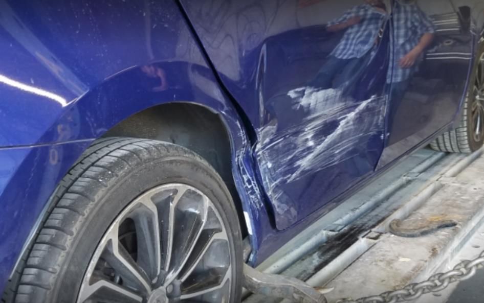 A rack for loading smartphones with a view of neatly organized cell phones, charging plugs, and wires.